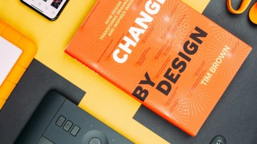 Change by Design by Tim Brown book beside smartphone
