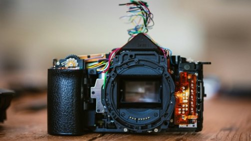a camera sitting on top of a wooden table