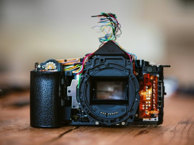 a camera sitting on top of a wooden table