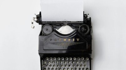 black Fayorit typewriter with printer paper
