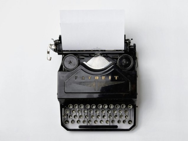 black Fayorit typewriter with printer paper