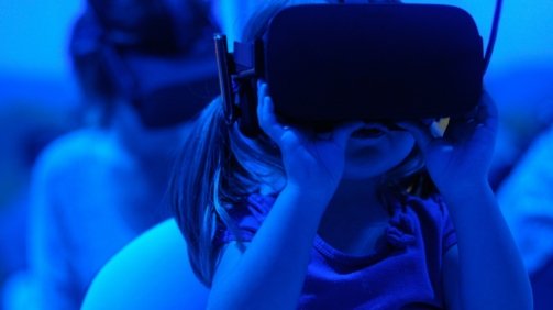 girl using VR goggles