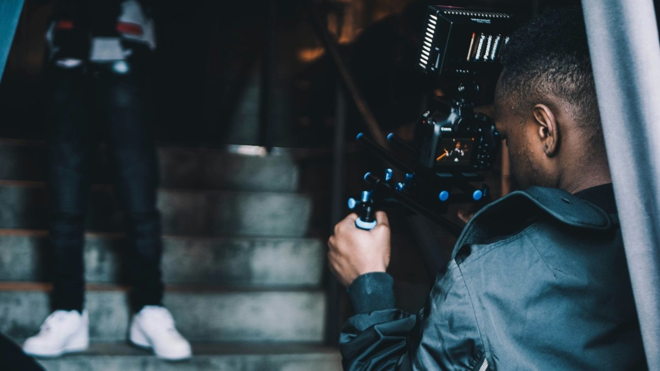 man taking photo of another man