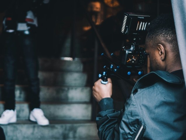 man taking photo of another man