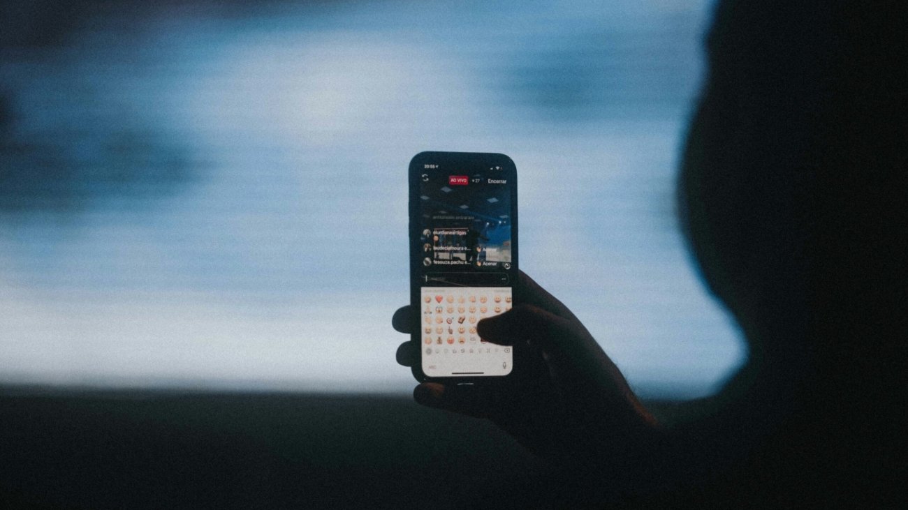 person holding black iphone 4