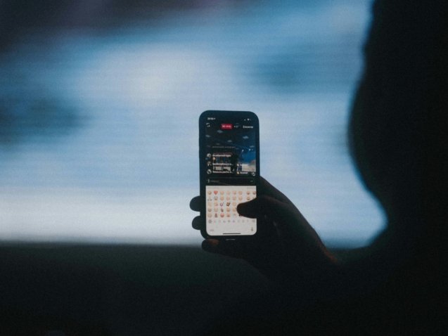 person holding black iphone 4