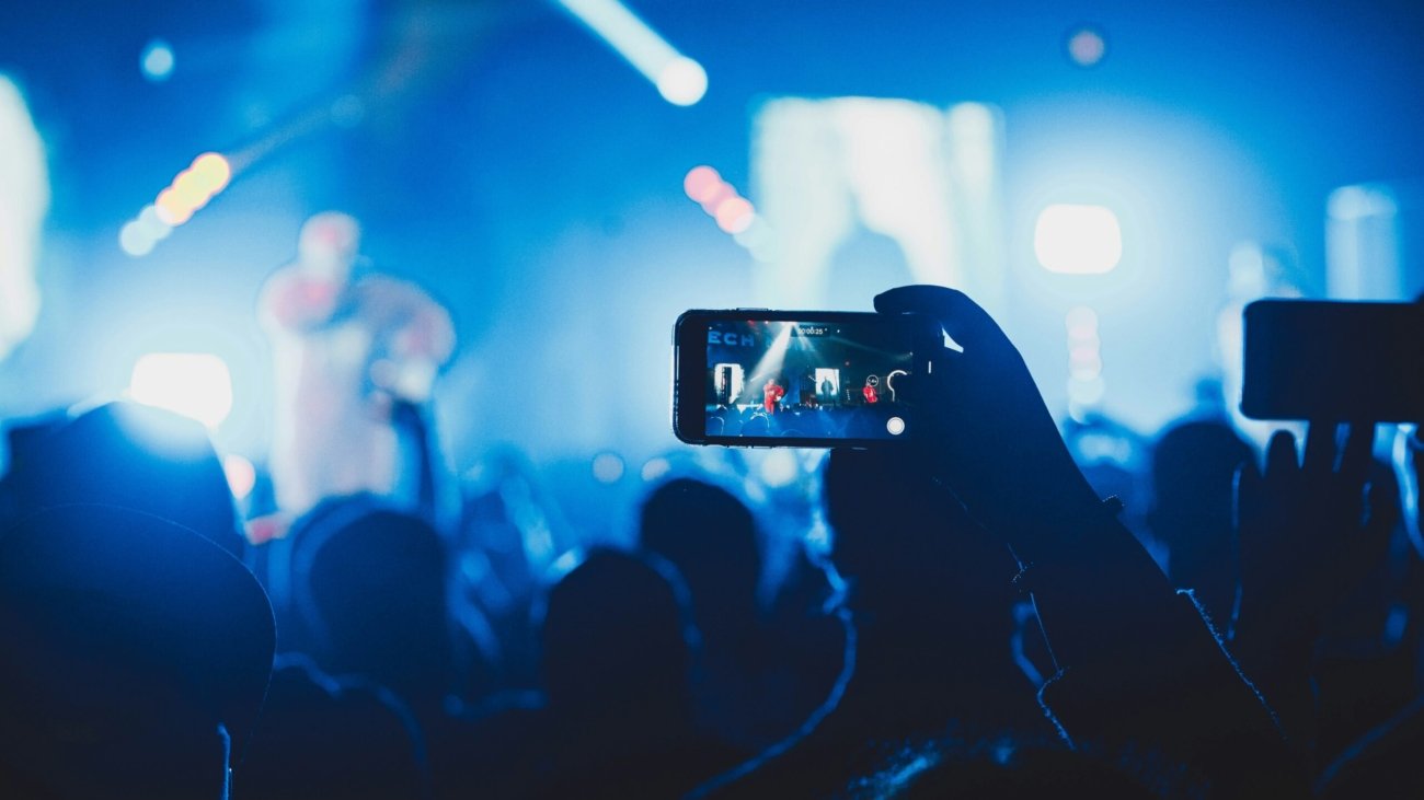 person taking picture on stage