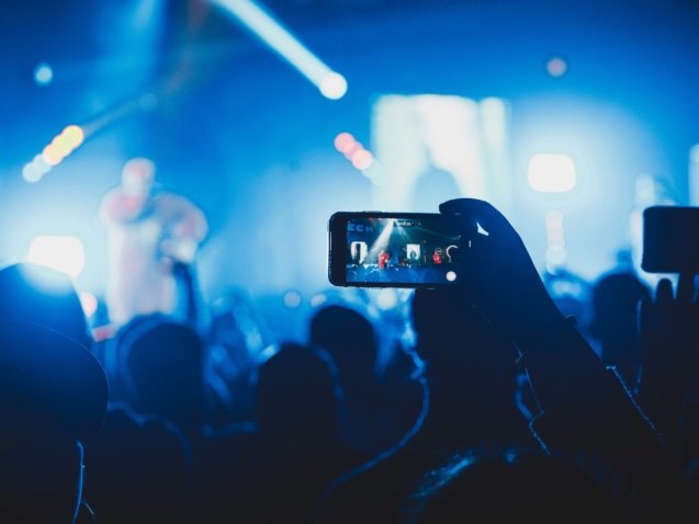 person taking picture on stage