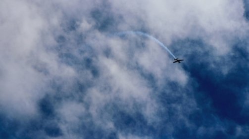 plane flying near clouds