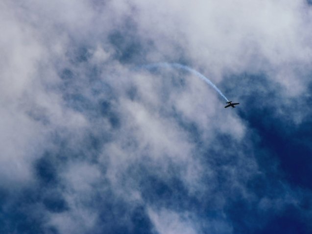 plane flying near clouds